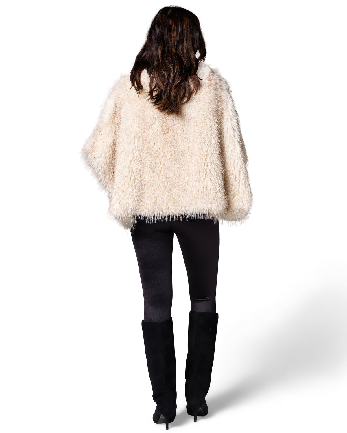 The FREED Collette Pebble cape pairs airy cream faux fur with a bold, effortless silhouette.