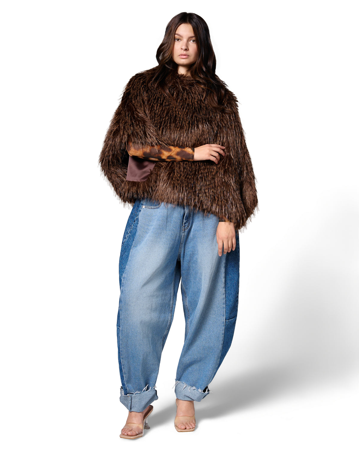 Model wearing the FREED Collette Sable faux fur cape, featuring rich brown tones and a dramatic textured silhouette.