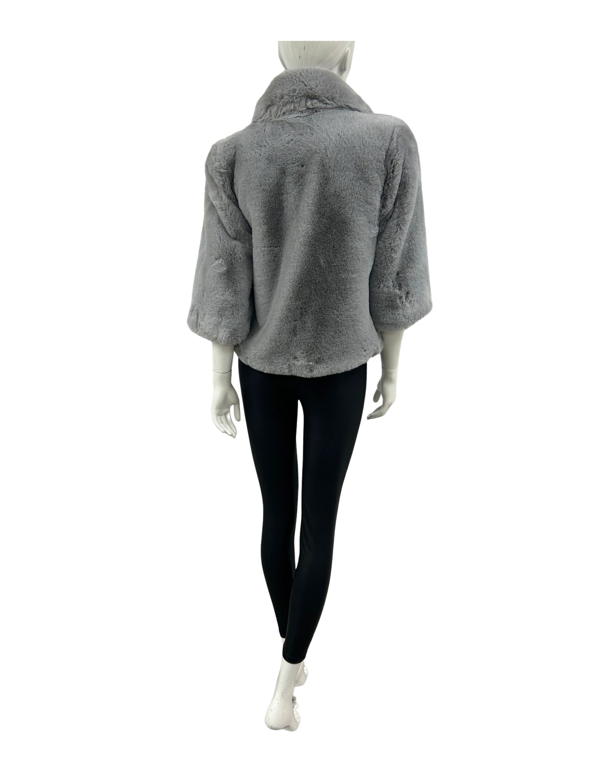 Mannequin wearing a gray cropped blazer from cruelty free fur