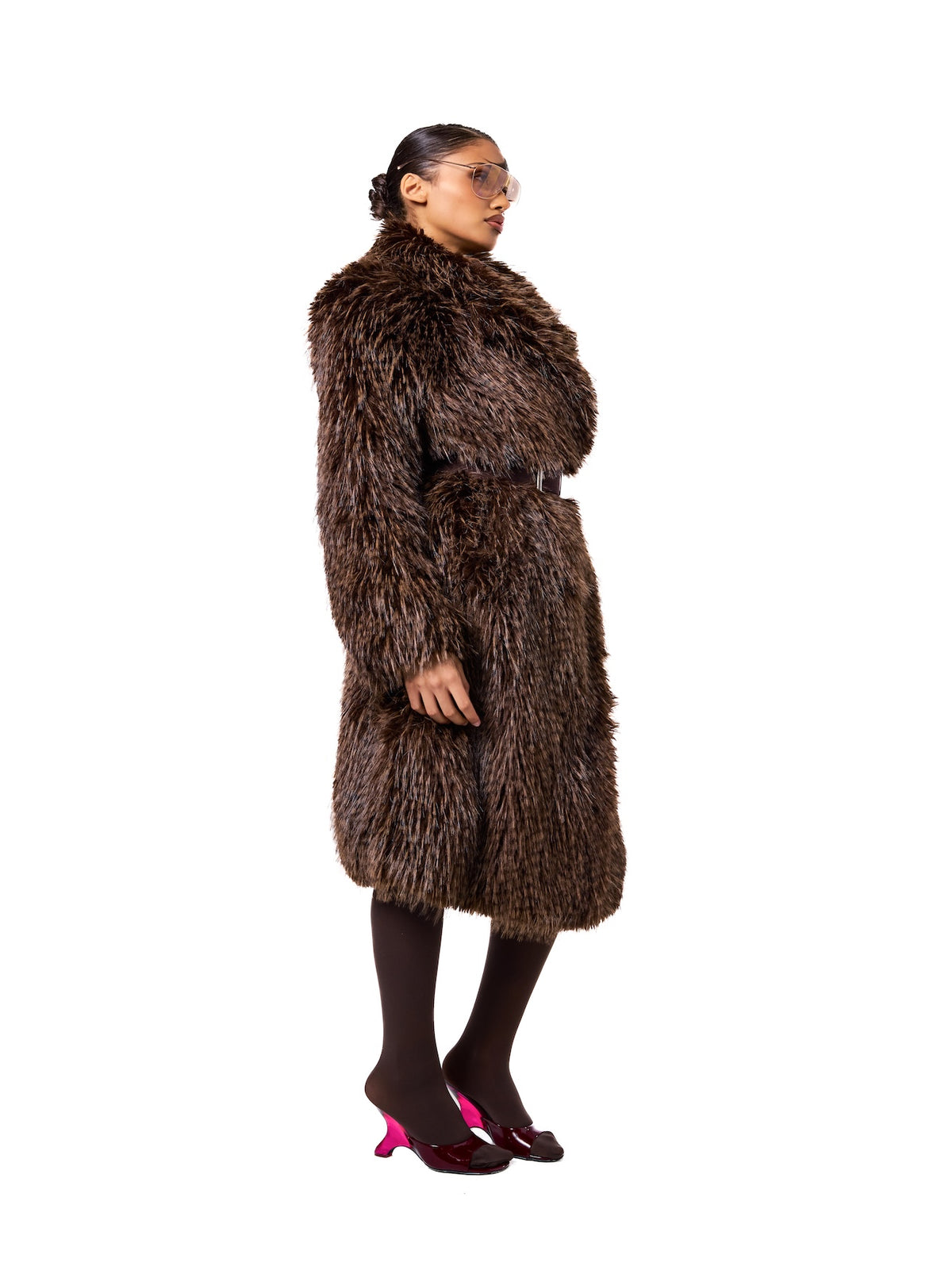 Side view of the LONDON Sable faux fur coat showcasing the rich textured finish, relaxed silhouette, and elegant midi length.