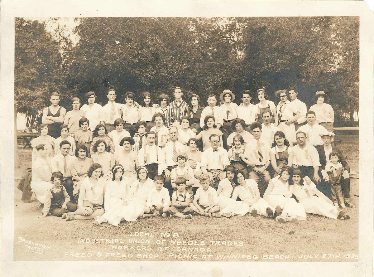 An old group photo of the Industrial Union of Needle Trades from 1929.