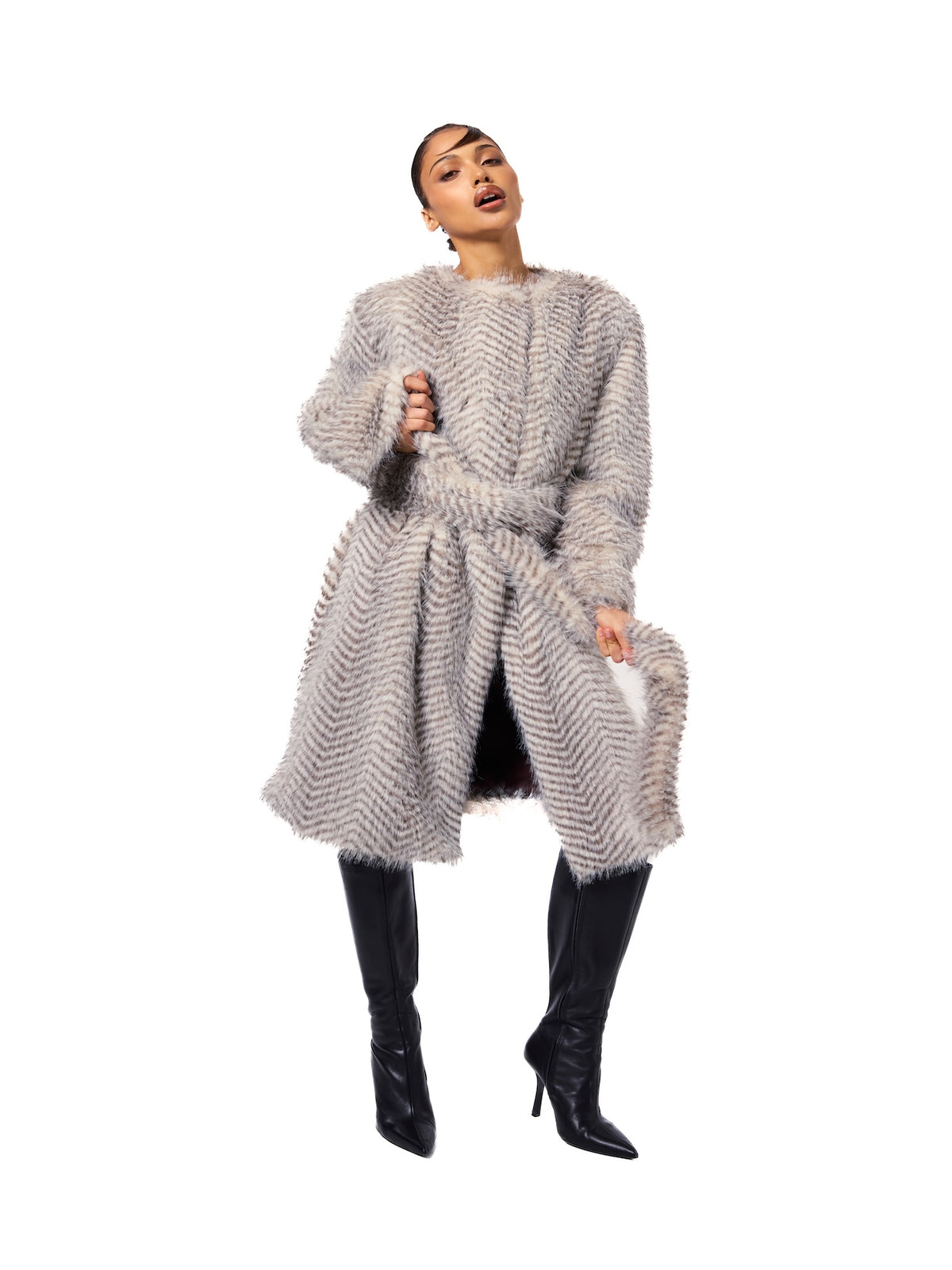 STELLA coat in Snow Lynx featuring premium cruelty-free faux fur, a removable self-belt, midi-length silhouette, and elegant winter styling.