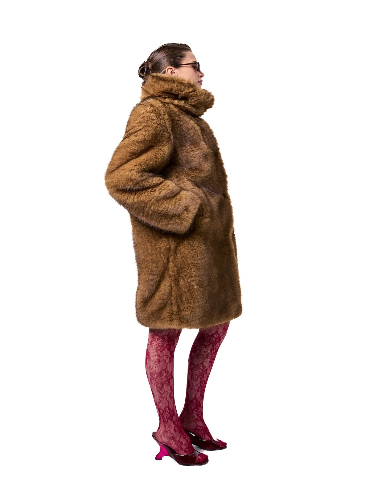 AUDREY coat in Bronde — side profile highlighting the luxurious faux fur texture, dramatic stand collar, mid-length fit, and warm bronde color.