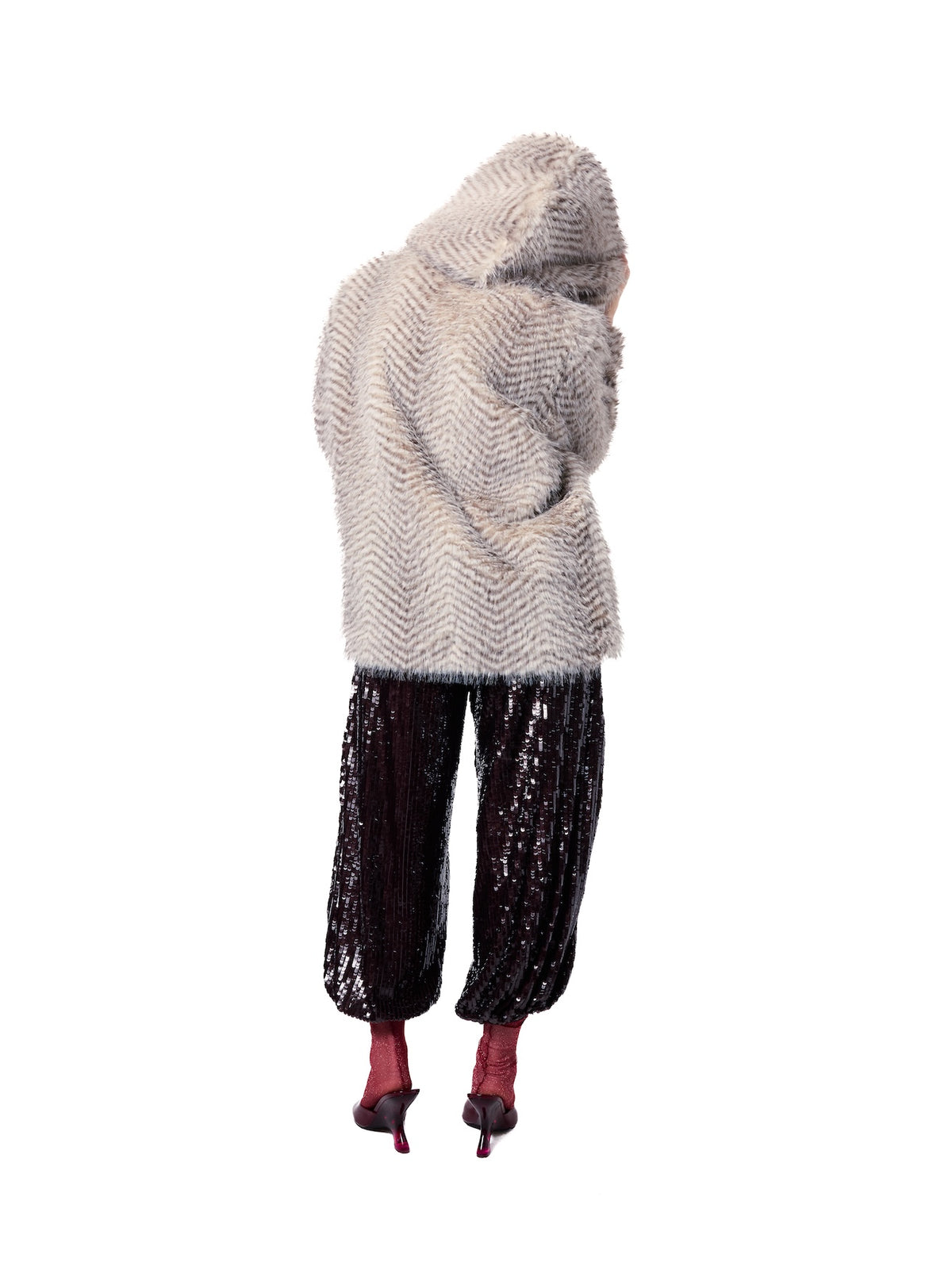 Back view of the NIKI Snow Lynx faux fur jacket highlighting the oversized hood, premium faux fur texture, and comfortable relaxed silhouette.